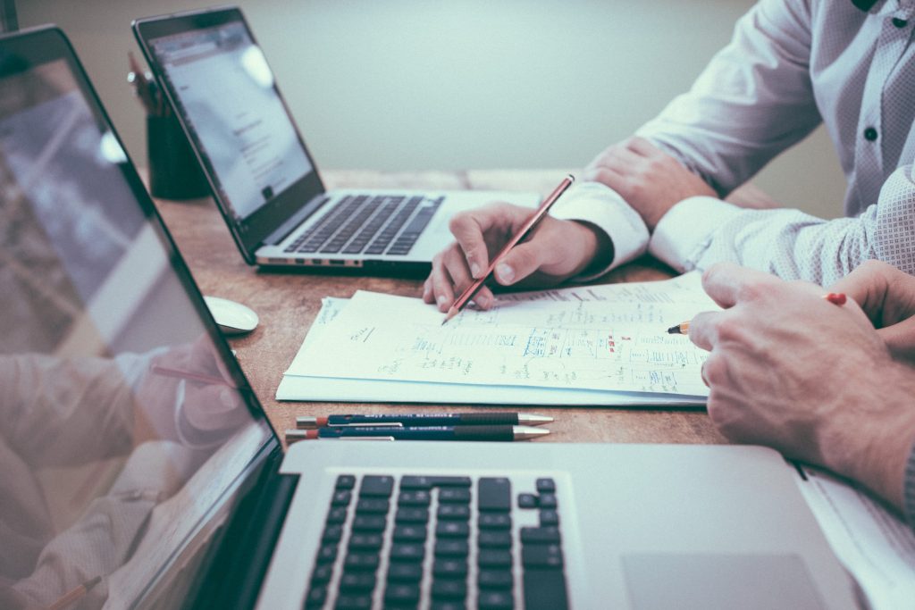 "Hands analyzing documents, ERISA attorney #ERISA #InsurancePolicies"